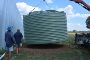 Water tank being installed at the back of the hangar